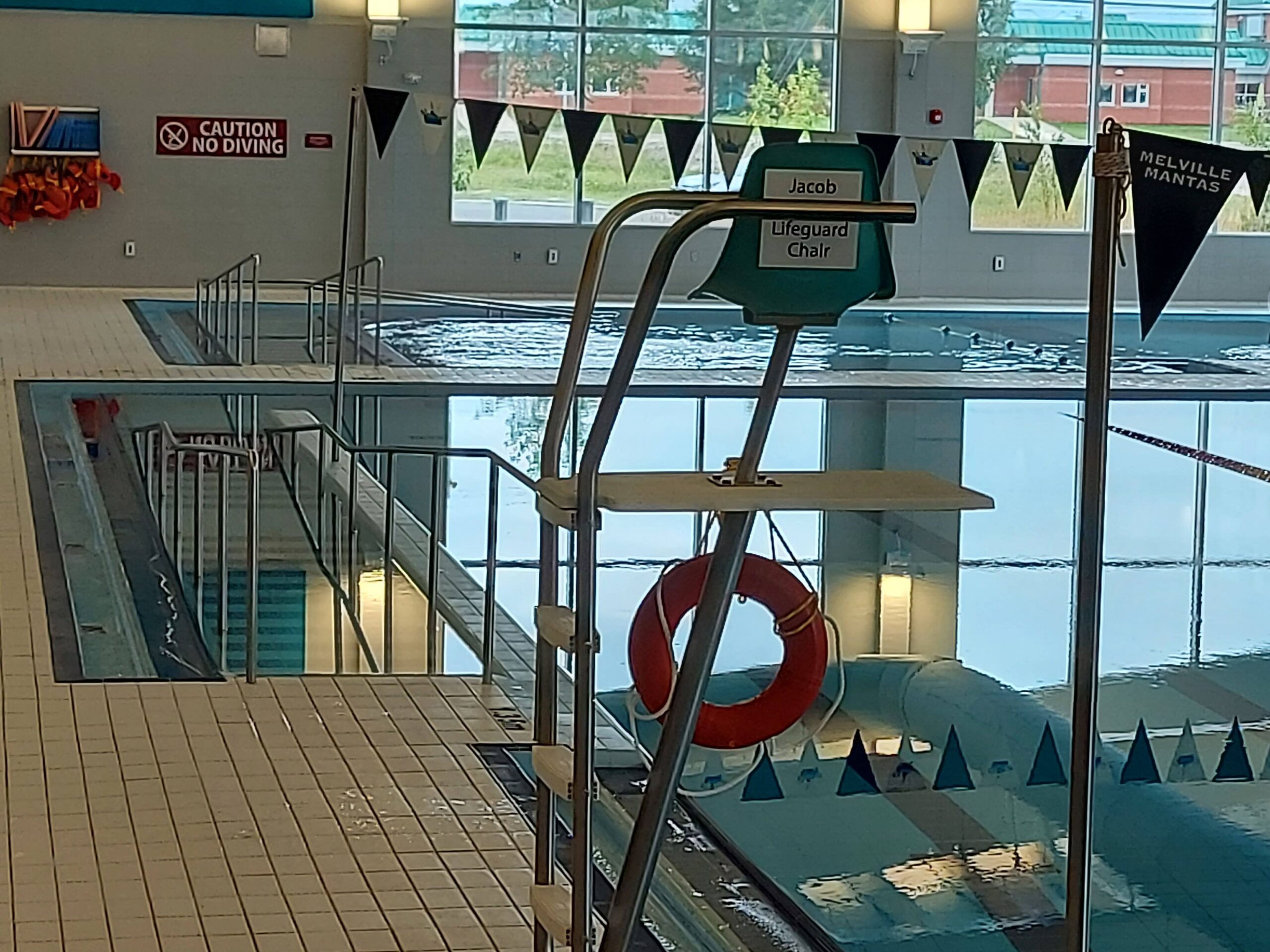 a zoomed in photo of the lifeguard chair by a poolside